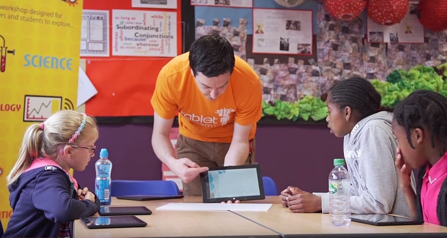 Tablet Academy demonstrating a STEM app to pupils.